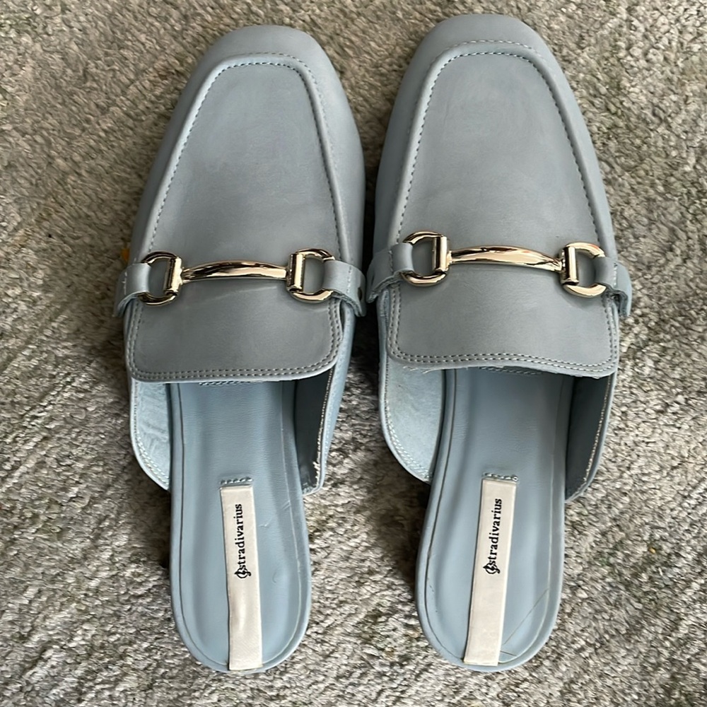 Worn once . Blue slides with silver hardware.